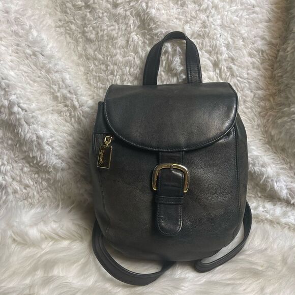 Tignanello leather black small backpack/ sling back with gold tone hardwares..